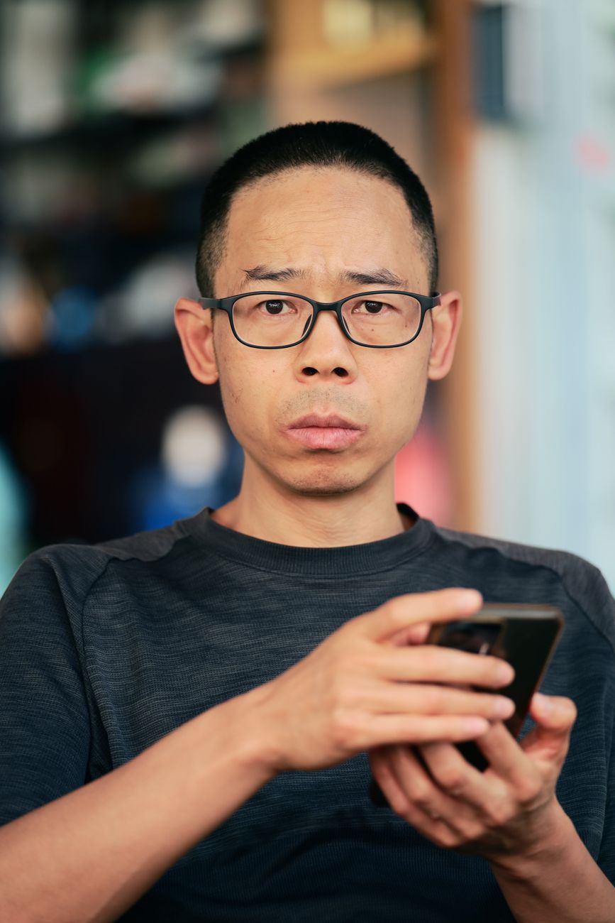 Man inspecting phone notification closely